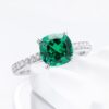 18K White Gold Emerald Ring with Four-Prong Setting and Diamond Accents