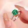 18K White Gold Emerald Ring with Four-Prong Setting and Diamond Accents