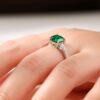 18K White Gold Emerald Ring with Four-Prong Setting and Diamond Accents